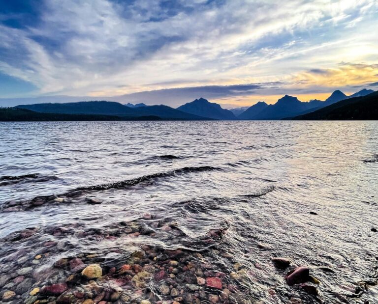 Colorful stones by tranquil water